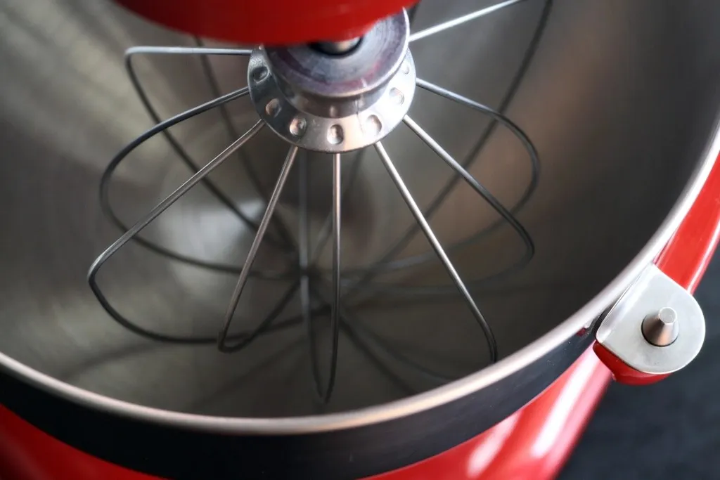 Close-up of a stand mixer whisk and bowl