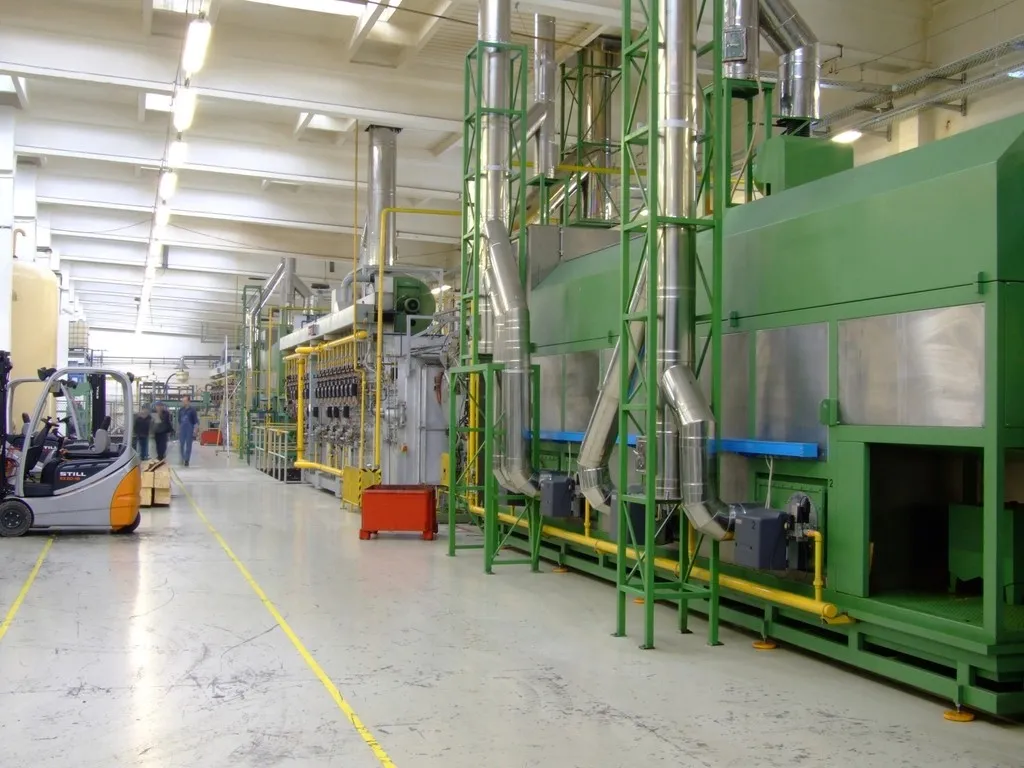 Production line machinery in a large factory hall