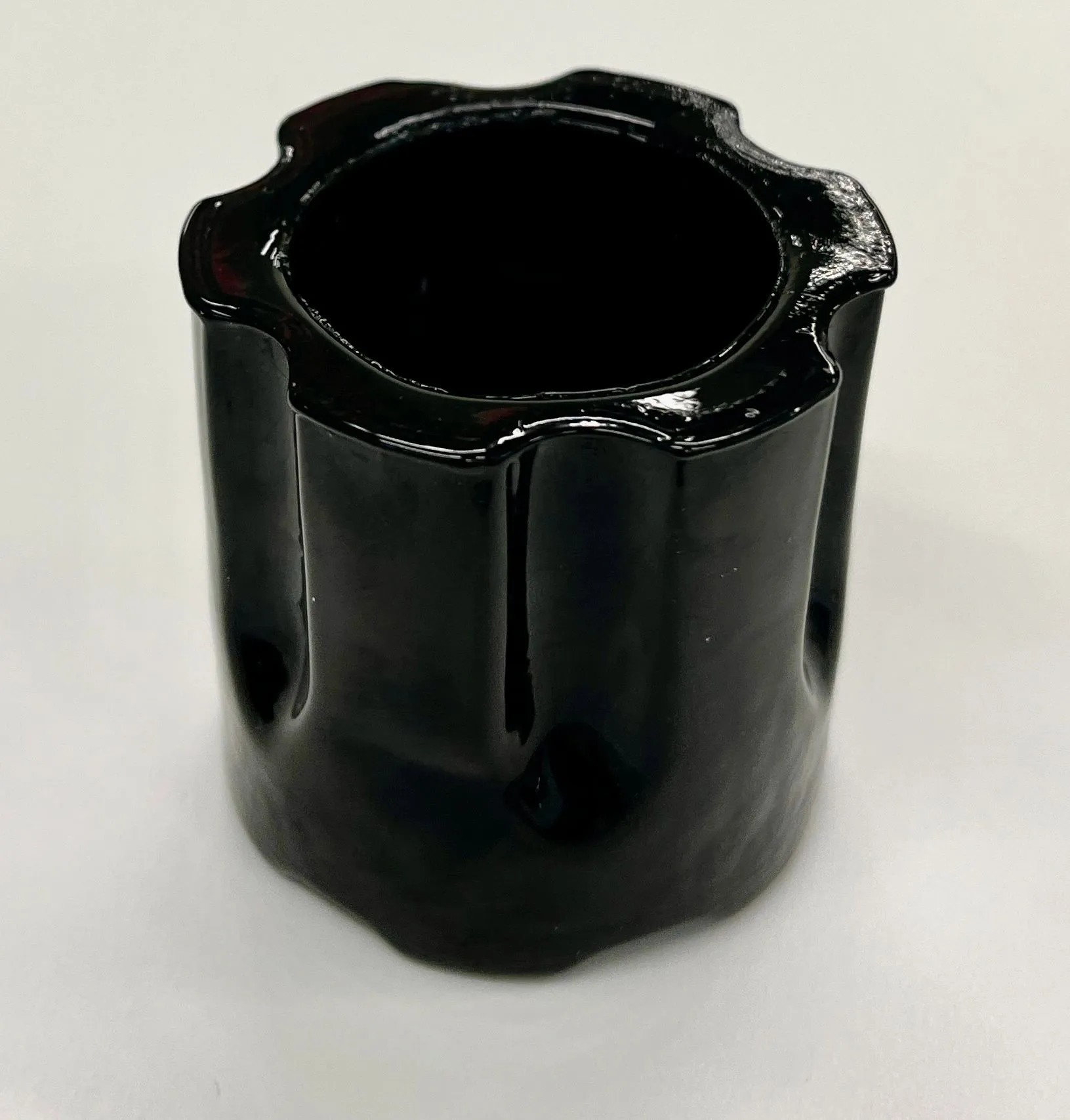Shot glass shaped like a revolver cylinder